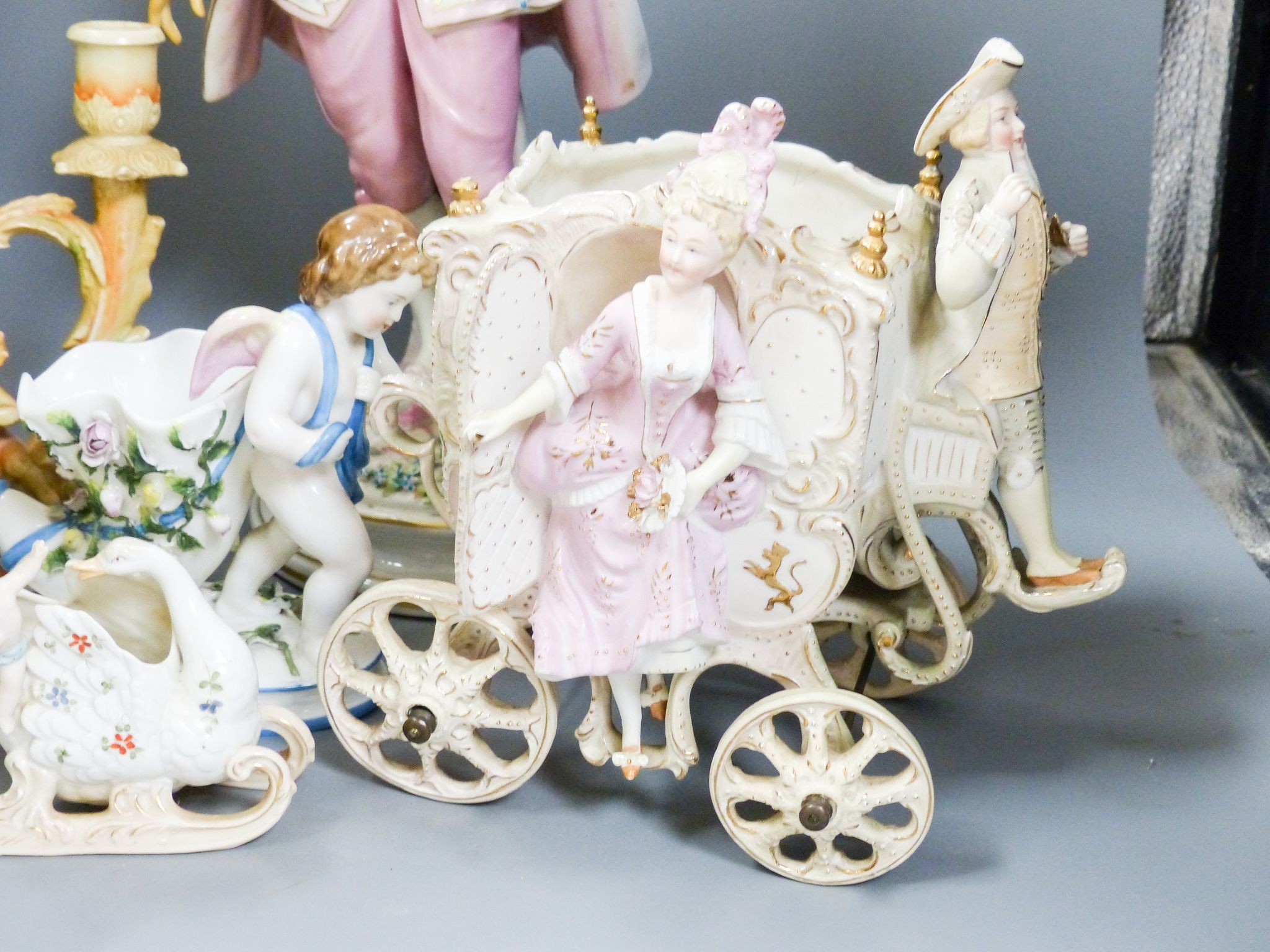 A bisque carriage centrepiece, a Continental figure and decorative items